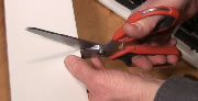 Cut plastic with scissors